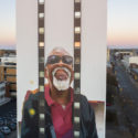 EVOCA1 paints image of local Rudy Daniels on the side of methodist Towers in Erie, Pennsylvania